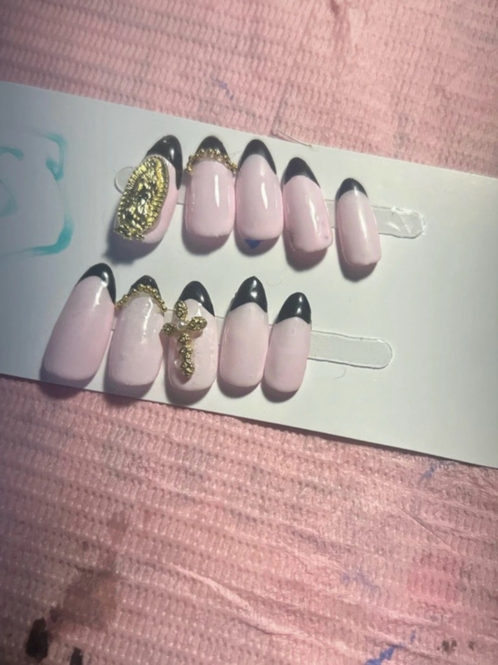 Soft Pink Press-On Nails with Black Tips and Gold Charms